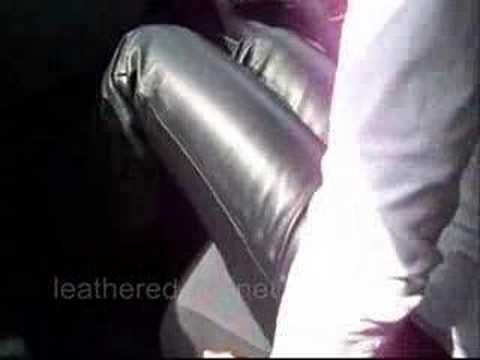 Leathered Life - she is wearing leather pants in the car
