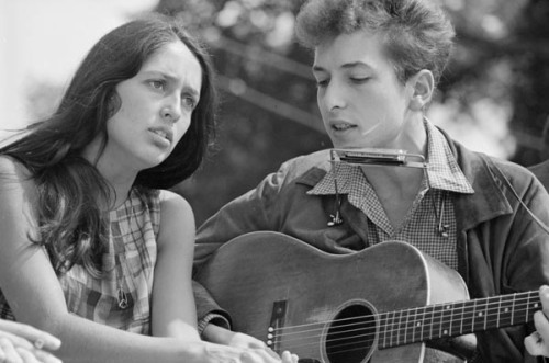 Singers Joan Baez and Bob Dylan perform together during the 1963 March on Washington for Jobs and Freedom